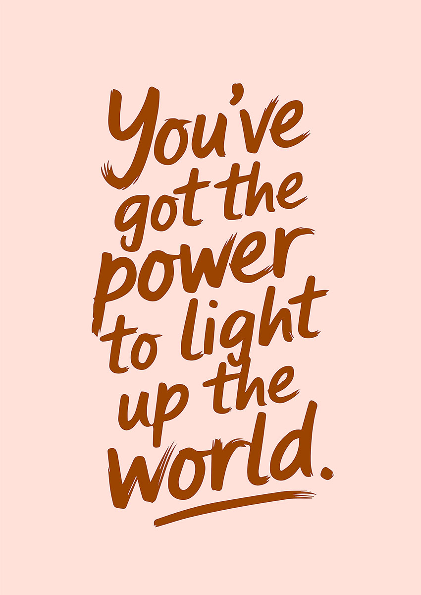 Inspirational text artwork with the phrase 'You've got the power to light up the world' on a soft pink background.